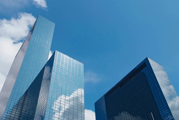 istock modern skyscrapers in Rotterdam with reflections of clouds 1039798062