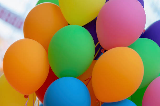 istock Bright multicolored balloons close-up, festive colorful abstract background for different themes 1039799158