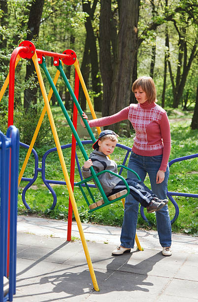 istock Boy and mother on pleasure-ground. 103980157