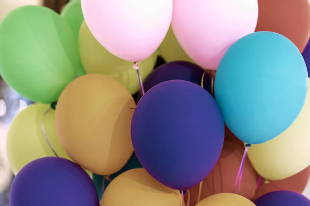 Bright multicolored balloons close-up,matte shades, festive abstract background for different themes