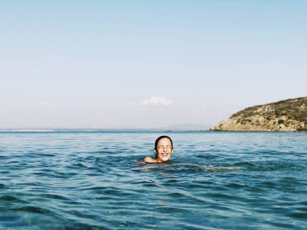 istock Blond woman enjoying sea 1039811138
