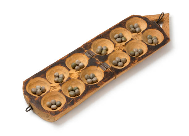 Traditional African oware game with seeds stock photo