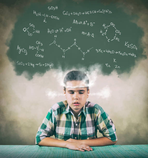 Schoolboy struggling with chemistry Boy with boiling head feeling tired and bored of too complicated chemistry formulas and equations boring homework twelve stock pictures, royalty-free photos & images