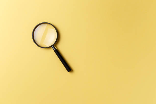 istock Magnifying glass on yellow background. Top view. Flat lay. Copy space. Concept 1039820698