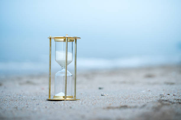 istock Sand clock on the beach, business time management concept 1039822494