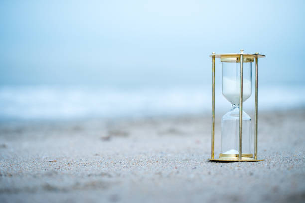 istock Sand clock on the beach, business time management concept 1039822670