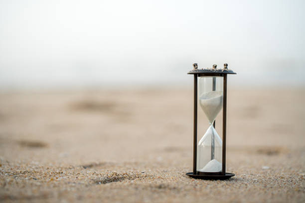 istock Sand clock on the beach, business time management concept 1039824092