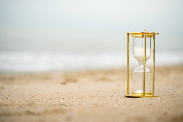 istock Sand clock on the beach, business time management concept 1039824818