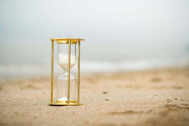 istock Sand clock on the beach, business time management concept 1039824946