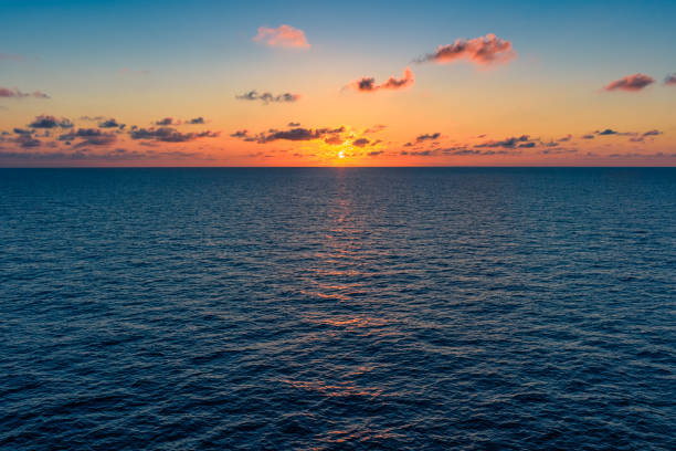 Sunrise over the Gulf of Mexico Idyllic sunset over the open ocean gulf of mexico photos stock pictures, royalty-free photos & images