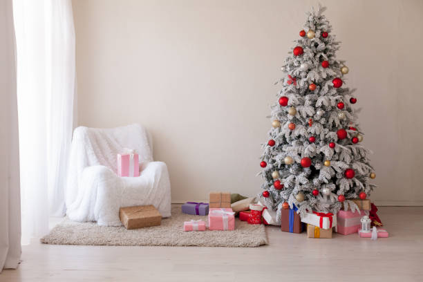 istock Christmas decoration Christmas tree with presents in white 1039832796