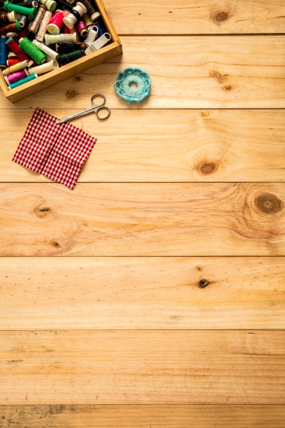 istock Box of tailor, scissors and sewing threads with colorful bobbins for patchwork 1039833416