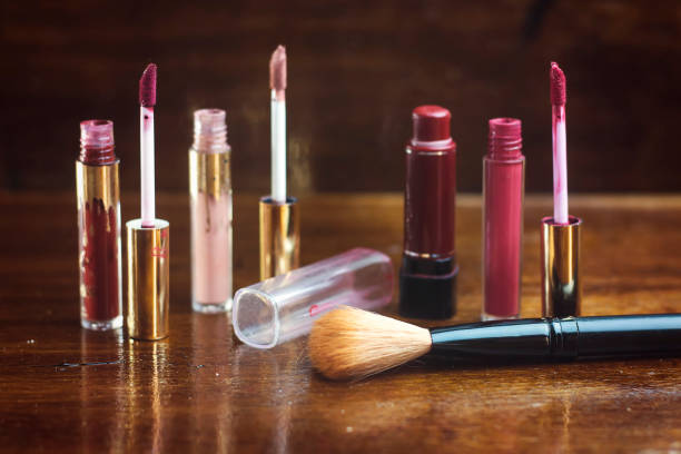 istock differents colorful lipsticks and brush on wood table 1039835512