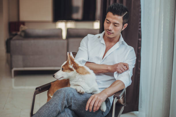 istock Gentleman relaxing with his dog 1039848542