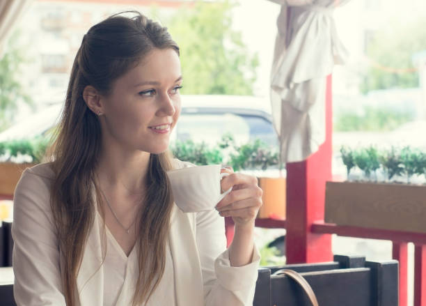 istock Gorgeous cheerful woman freelancer with good mood using laptop computer for distance work during lunch in cafe bar, attractive female with beautiful smile sitting with portable net-book in coffee shop 1039874264