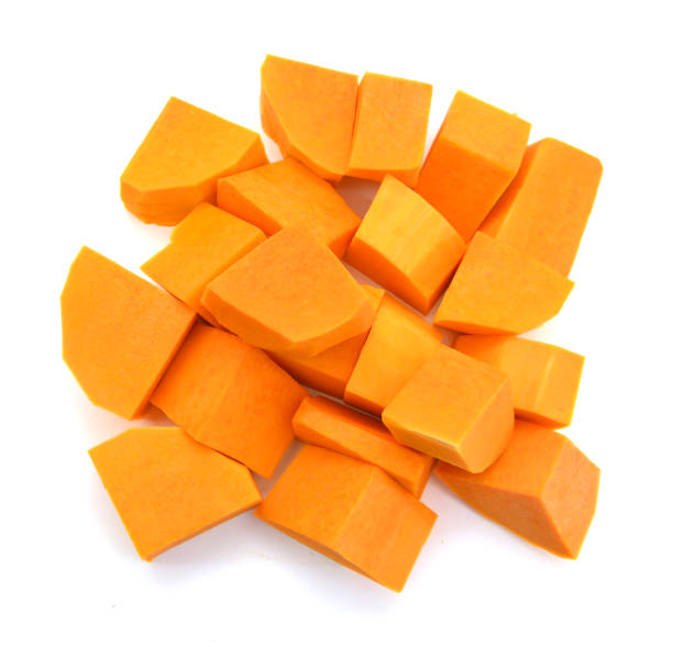 istock A group of cut and slice butternut squash chunks on a white background. 1039875178