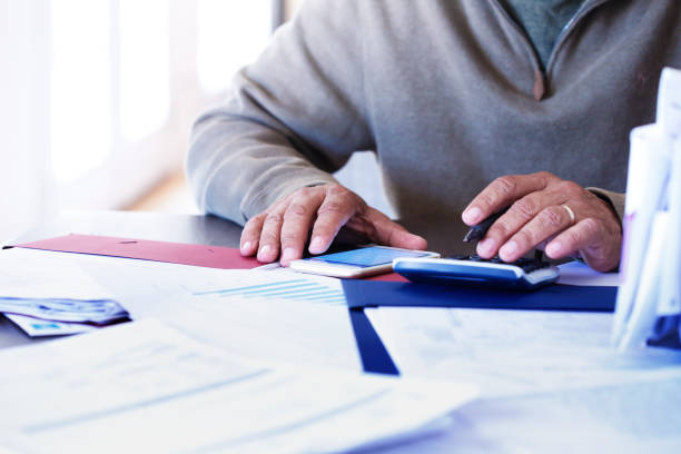 istock Close Up Of Man Using His Mobile Phone To Pay His Bills 1039875548