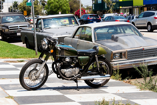 Vintage, classic and modern cars and motorcycle in the street in Los Angeles, California