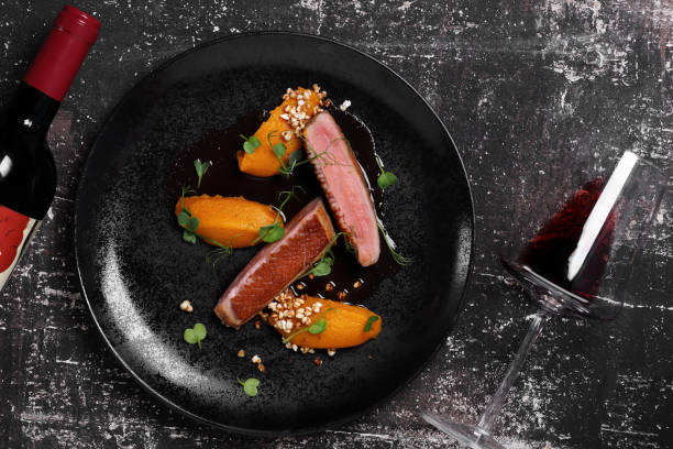 istock duck breast on a black platter 1039890444