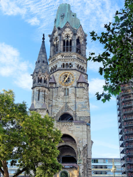 Berlin, Germany Kaiser Wilhelm Memorial Church, ruin of the imperial church in Berlin, Germany, not rebuilt as a reminder of World War II - and the modern belfry that was added in 1963 kaiser wilhelm memorial church stock pictures, royalty-free photos & images