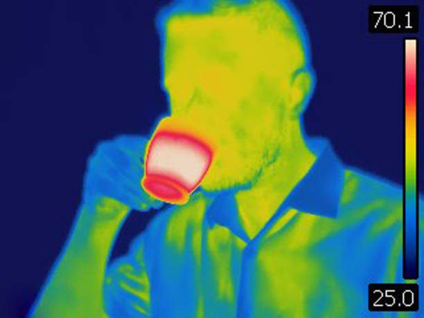 istock Thermal image of man drinking hot coffee 1039917646