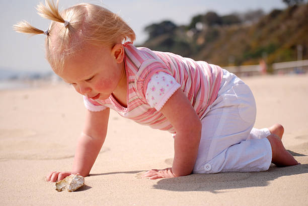 istock Toddler having fun at the beach 103993250
