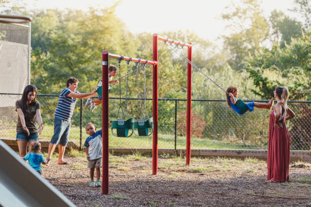 istock Neighbors talking and children playing in the park 1039934372