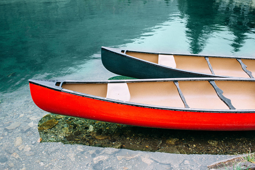 Two canoes floating peacefully on the clear Lake Champex, Switzerland