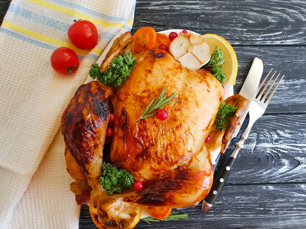 istock fried chicken whole, garlic, greens on a wooden background 1039938734