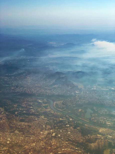 istock City covered by fog on top view. 1039941860