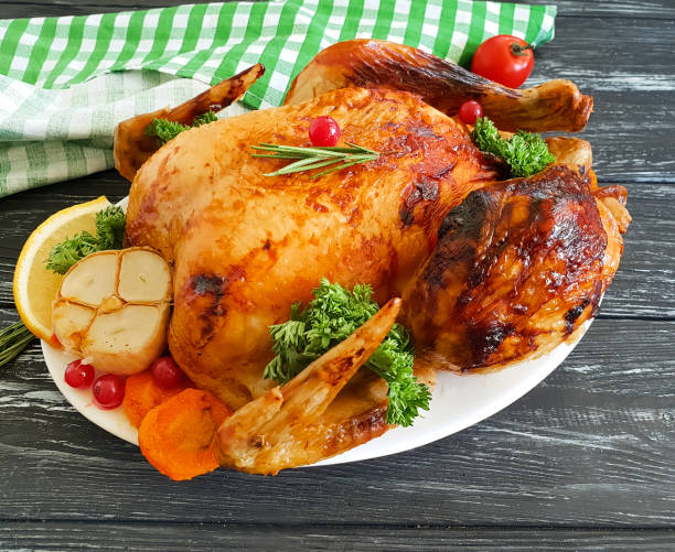istock fried chicken whole, garlic, greens on a wooden background 1039941960