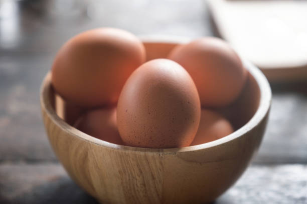 istock Boiled eggs in wooden bowl for breakfast 1039941984