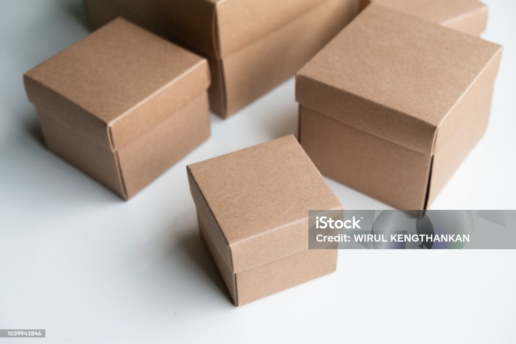 Grouping of cardboard boxes on white background, Light brown cardboard boxes, Carton box, Online Shopping and Ecommerce Concept. Adult Stock Photo