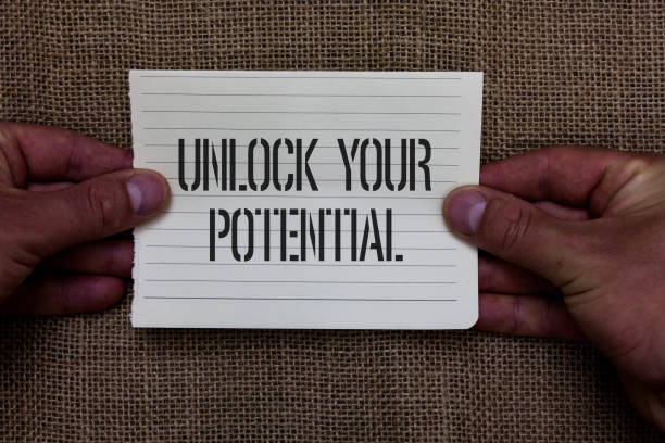 istock Text sign showing Unlock Your Potential question. Conceptual photo Maximize your Ability Use God given gift Man holding piece notebook paper jute background Communicating ideas. 1039955024