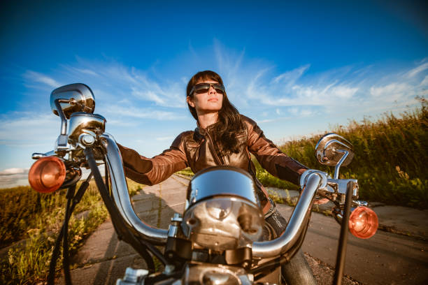 istock Biker girl sitting on motorcycle 1039957866