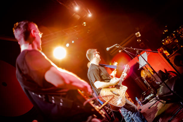 istock Band performs on stage in a nightclub 1039958004