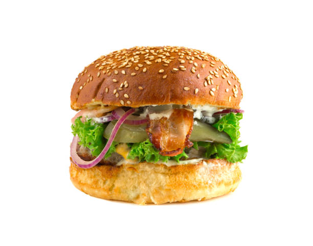 istock Burger close-up on a white background. Fried beef cutlet on grill, green salad, tomato, bacon, pepper jalapenju and bun with sesame. 1039962916