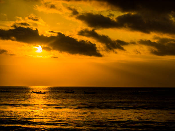 istock sunset at Kuta beach in Bali, Indonesia 1039969236