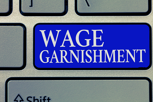 Conceptual hand writing showing Wage Garnishment. Business photo showcasing Deducting money from compensation ordered by the court.