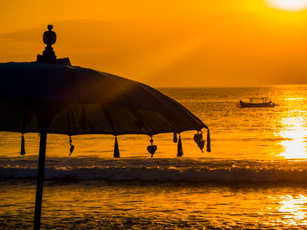 istock sunset at Kuta beach in Bali, Indonesia 1039970382