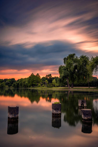 istock Sunset shot with long exposure for dramatic clouds in a park 1039970946