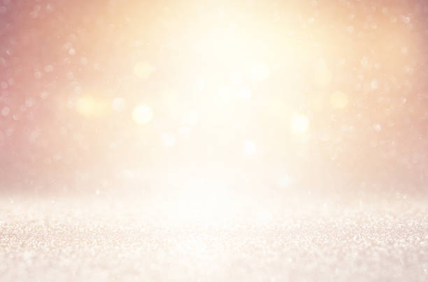 istock glitter vintage lights background. silver, gold and white. de-focused. 1039995746
