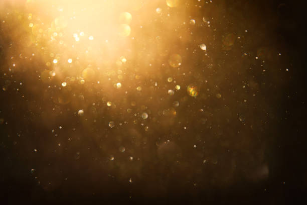 istock glitter vintage lights background. black and gold. de-focused. 1039995872