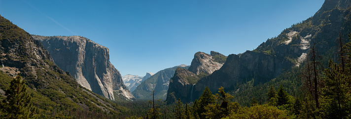 A wide shot of some of the features in Yosemite, including El Capitan.  California, June 2018