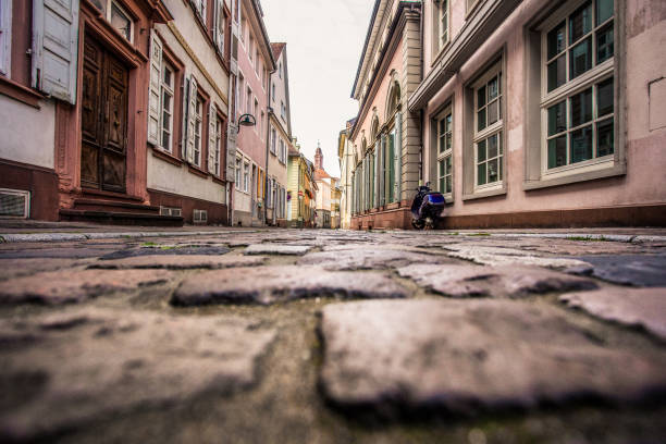 Old European cobblestone street from low perspective, Heidelberg Germany
