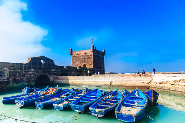 Blue fisher rowing boats in the port of Essaouira - Morocco stock photo