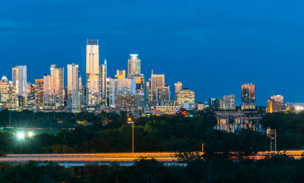 glowing nightscape austin texas blue hour right past sunset in the capital city of texas growing skyline modern 2018 - highway nobody town urban road imagens e fotografias de stock