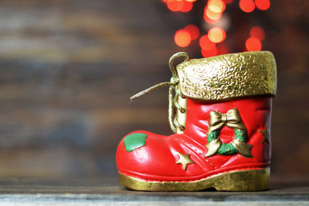 istock Christmas boot and blurred lights in background 1040011768