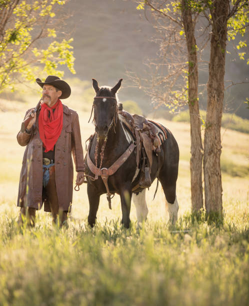 istock Cowboy sheriff with paint horse 1040018366