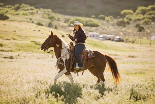 istock Cowgirl Horseback Riding 1040018468